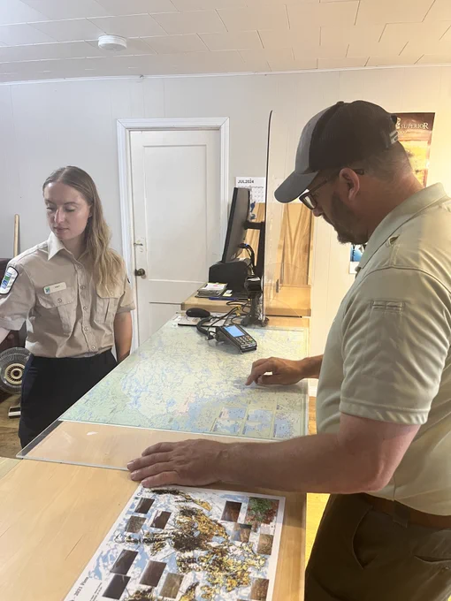 Two federal employees in an office. 