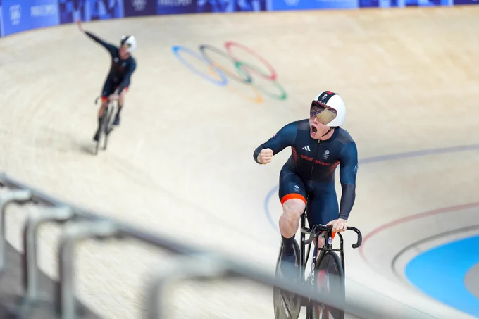 Jack Carlin celebrates on the track