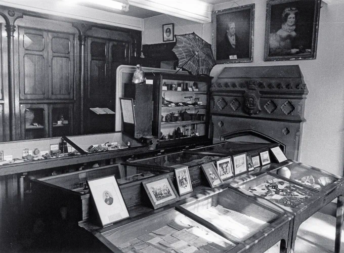 Display cases and portraits.