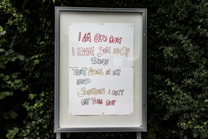 The work on display reads "I am old now ⁠
I have seen many things that swirl in my head⁠
sometimes I can't get them out"⁠