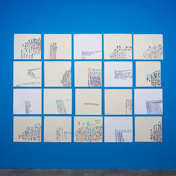 Installation view of Roland Young at Studio Voltaire. Unframed drawings are arranged in a grid formation on a blue wall.