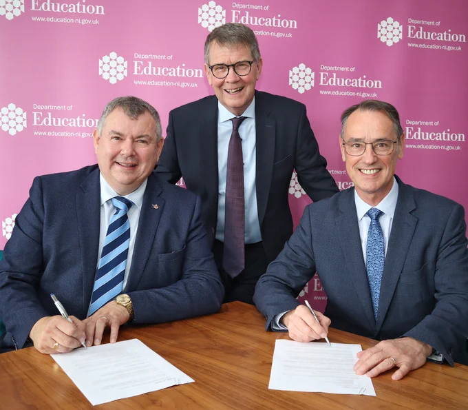 Picture of Ian Lowry, Woodvale-Lowry JV Limited, Ivor Sampson, Woodvale-Lowry JV Limited and Mark Browne, Department of Education Permanent Secretary signing the contract for the Strule Shared Education Campus.