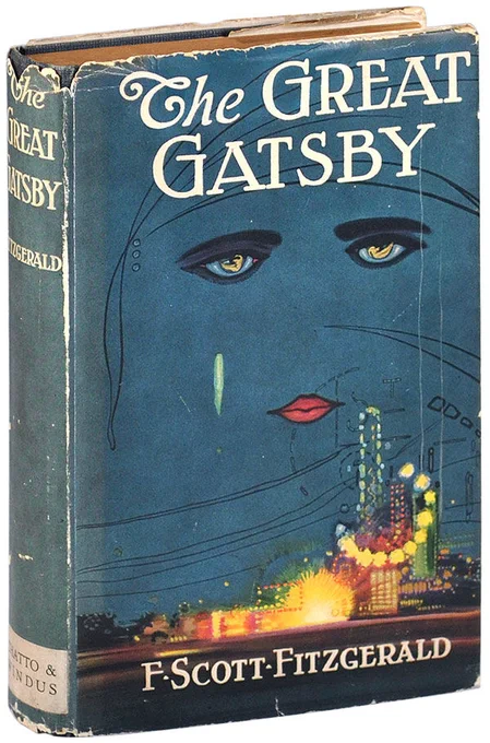 'The Great Gatsby' by F. Scott Fitzgerald was published in 1925. On the first edition cover, there is a dark blue sky with crying eyes and lips over a bright city street. Credit: Chatto & Windus