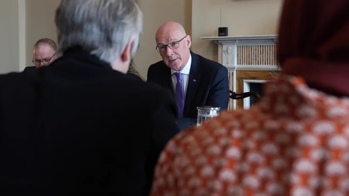 First Minister John Swinney meeting with faith and refugee community leaders.