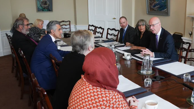 First Minister John Swinney and Minister for Equalities Kaukab Stewart meeting with faith and refugee community leaders.