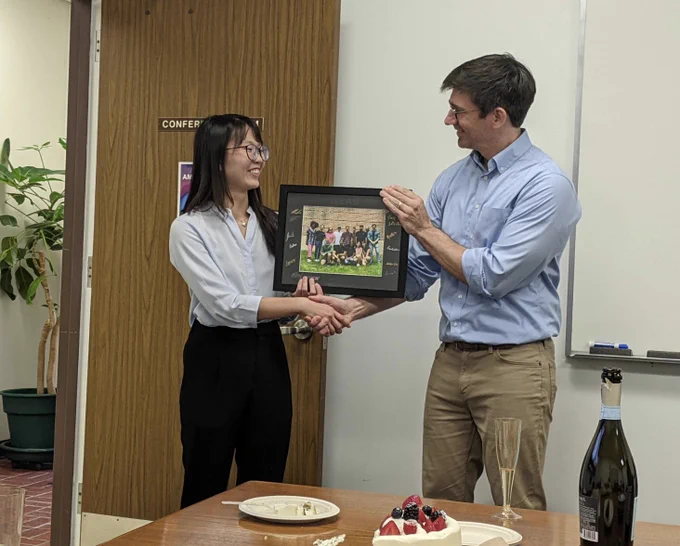 Faye receiving a PI Lab framed photo