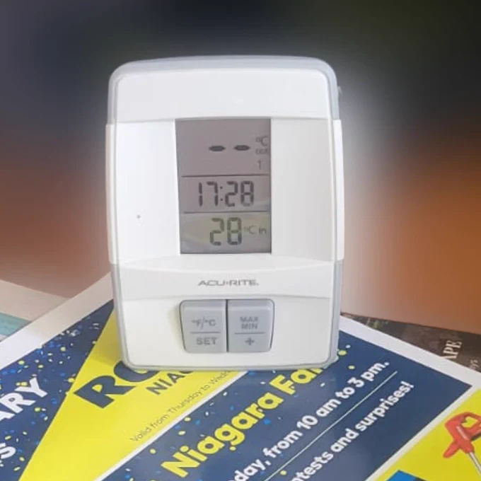 Photo of a digital thermomer showing a temperature of 28 degrees Celsius