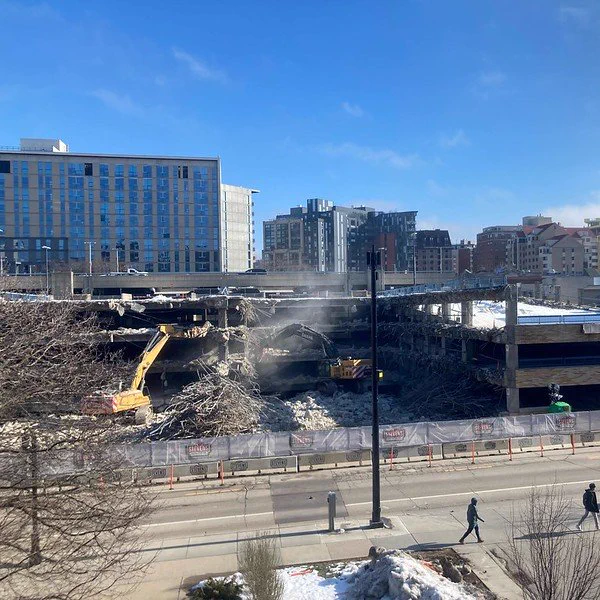 Photo of in-progress demolition of State Street Campus Garage in Madison, Wisconsin. Photo courtesy of the City of Madison on Flickr (January 29, 2024). Luminous Egress will subcontract to Stevens Construction Corporation for the photoluminescent path markings for safe emergency exit from the rebuilt garage, scheduled to reopen in 2026.