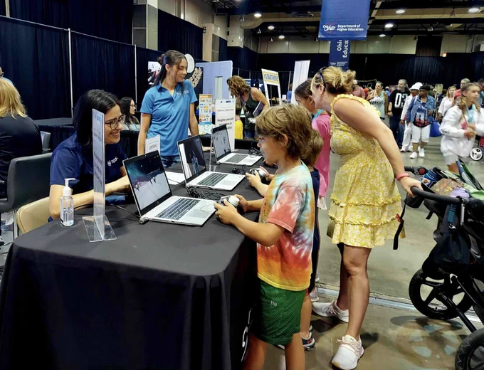 Ohio State Fair visitors at the Department of Higher Education booth. 