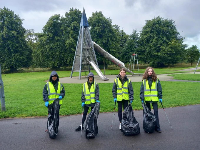 Police Scotland youth volunteers pictured outside at a litter picking event. 