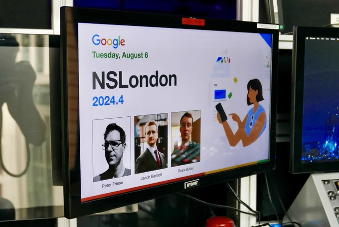 A photo of the intro slides on a monitor.