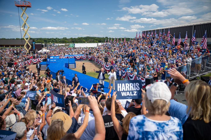 Vice President Kamala Harris and Governor Tim Walz wave to the crowd in Eau Claire, Wisconsin.