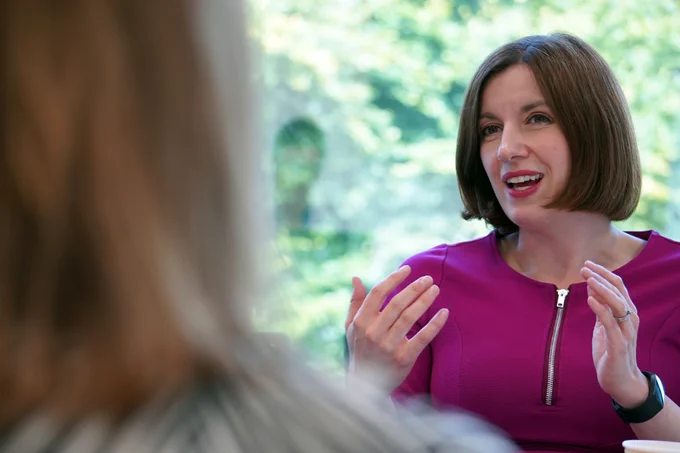 Image of the Minister for Women and Equalities, Bridget Phillipson, speaking across a table during a roundtable with 50:50 Parliament. 