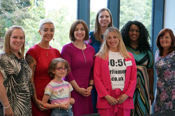 Group image of the Minister for Women and Equalities standing alongside members from 50:50 Parliament. 50:50 CEO, Lyanne Nicholl, stands next to the minister.