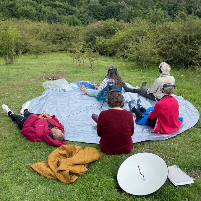 SoundWalk attendees sit in a circle