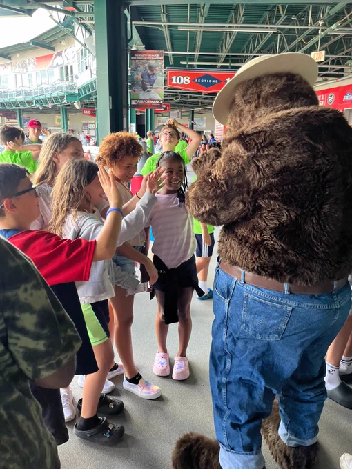 Smokey Bear at NH Fisher Cats - greeting fans at Summer Camp day