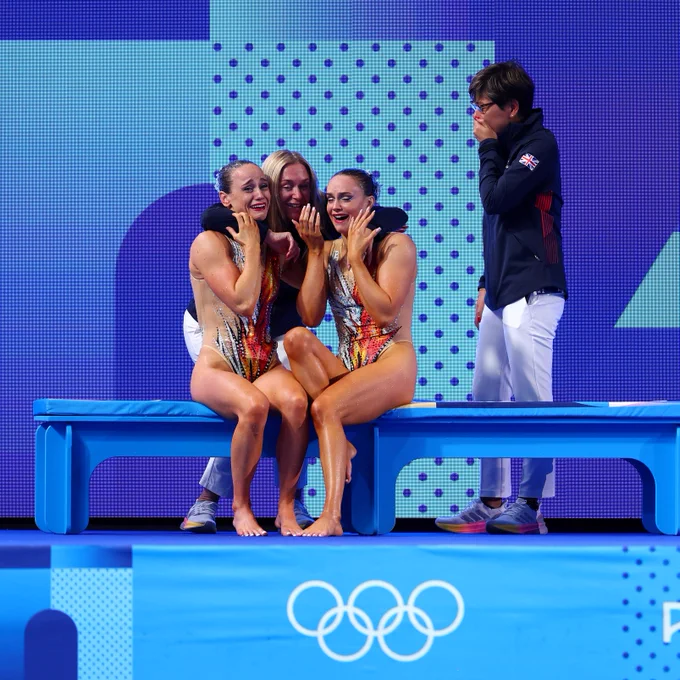 Izzy Thorpe and Kate Shortman hug their coaches in disbelief