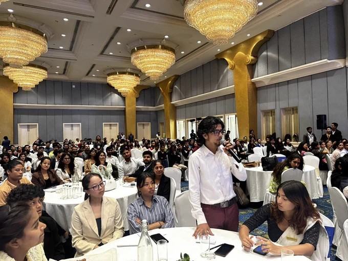 Image of a youth participants speaking on a mic