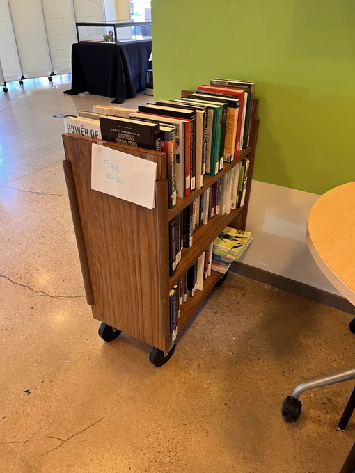 A cart of books with a sign that says Free Books
