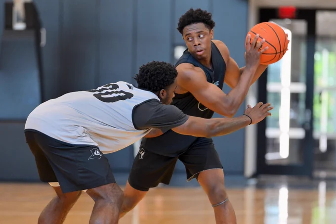 Jayden Pierre at practice guarded by Bensley Joseph