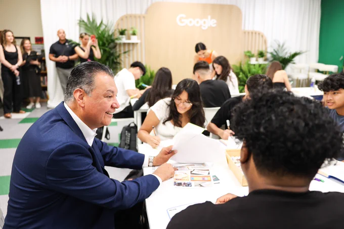 Photograph of U.S. Senator Alex Padilla sitting with high school students at a table in a classroom in a Los Angeles-area school. Photo taken at an event announcing the Google Mental Health Initiative – a collaboration with Selena Gomez's The Rare Impact Fund, DonorsChoose, The JED Foundation, Child Mind Institute and The Steve Fund – and a part of Google's Digital Wellbeing Fund.