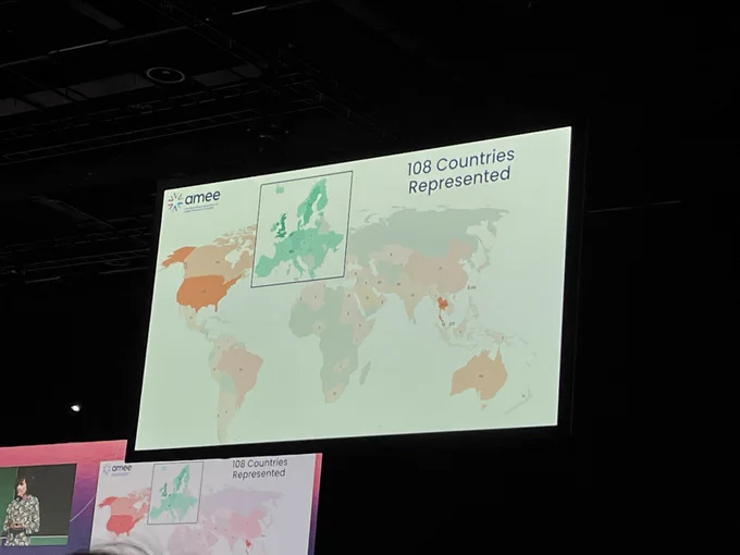 A presentation slide showing people coming to AMEE from 108 countries