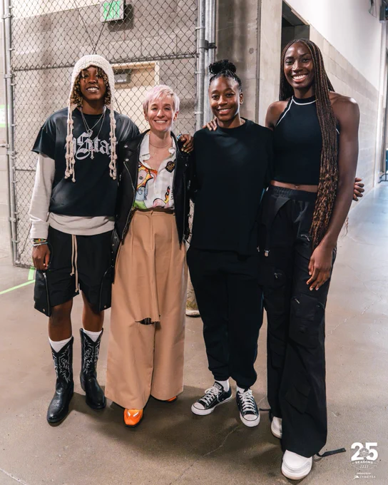 Jordan Horston, Megan Rapinoe, Jewell Loyd and Ezi Magbegor posing for a photo