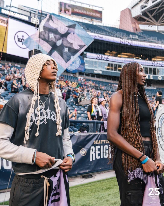 Jordan Horston and Ezi Magbegor on the field at Lumen Field