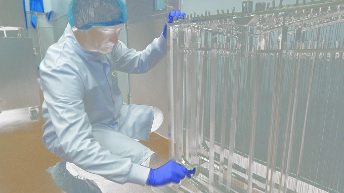 MASTER researchers created a unified approach to the analysis of food chain microbiomes. A researcher is seen swabbing equipment for analysis.