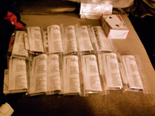Collection of "Mage player kits." Each ziplock bag had playing cards, character sheets, pencils, and a quest list tailored to each character.