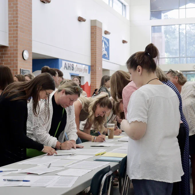 Educators sign in for the opening day ceremony