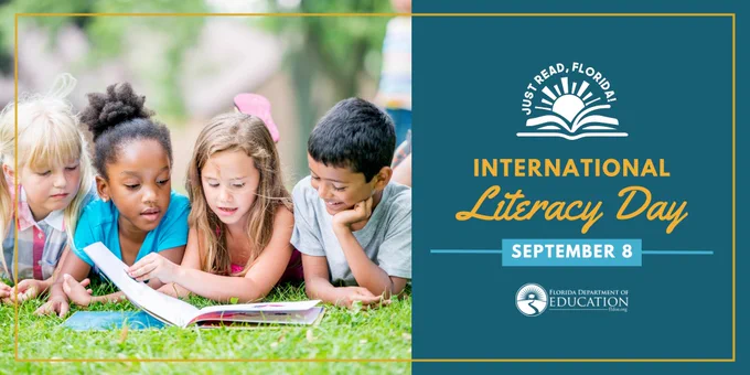 Children reading a book.