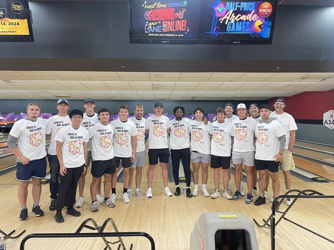 Baseball team before special Olympics bowling