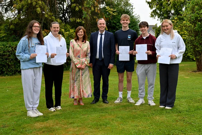 Education Minister Paul Givan pictured at Belfast High school in Newtownabbey with Principal Mrs Charlotte Weir and pupils Madison McFadden , Eva Wilson, Daniel Harvey, Jayden Lloyd and Holly Beckinsale,