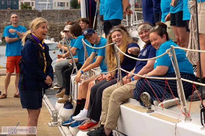 Young people onboard sail trainingnvessel Challenge Wales laugh with HRH The Duchess of Edinburgh