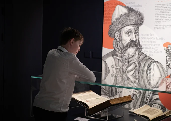 A student from Tynecastle High School looking at the Gutenberg Bible on display in the Library's 'Treasures' exhibition.