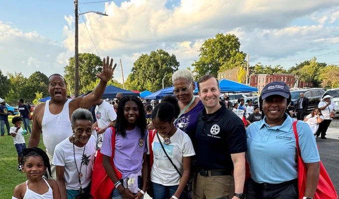 Chief Deputy U.S. Marshal Mathew Silverman stands with members of the Baltimore community. 