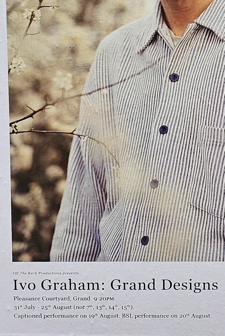 The torso of a man in a grey shirt