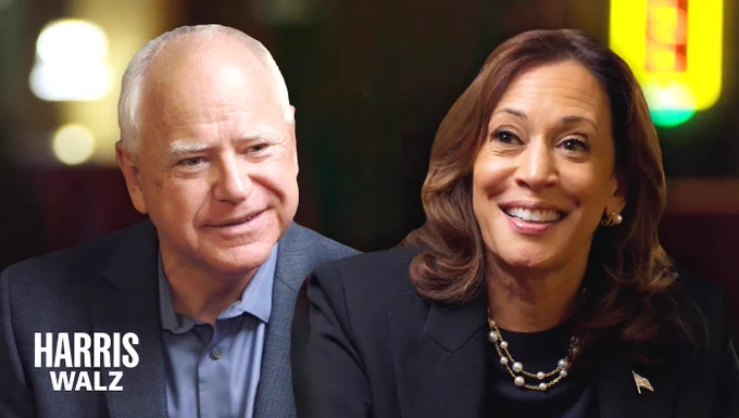 A composite image of Governor Tim Walz and Vice President Kamala Harris: Gov. Walz is at left in a blue suit and shirt. Harris is at right in a black suit with an American flag pin. Both are facing forward. A white Harris Walz logo is at bottom-left.