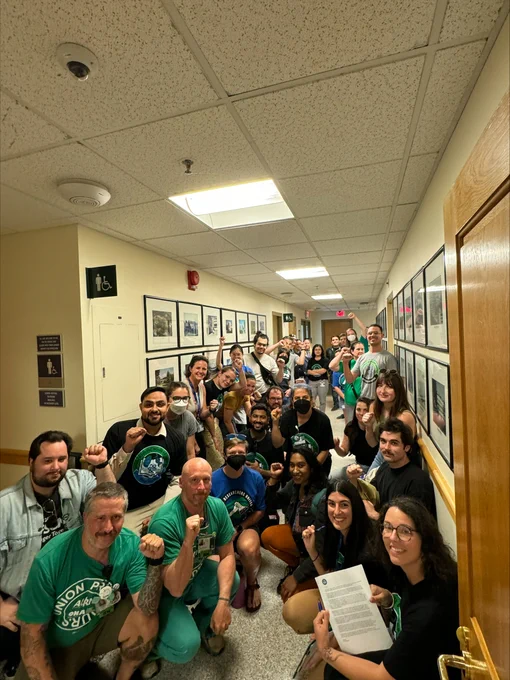 ONA members standing with and supporting OHSU postdocs, group photo in a hallway.