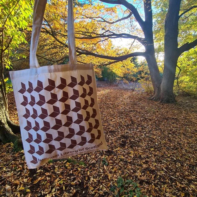 A National Library of Scotland tote bag in Edinburgh's Botanic gardens.