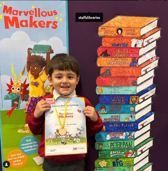 Child with certificate and medal