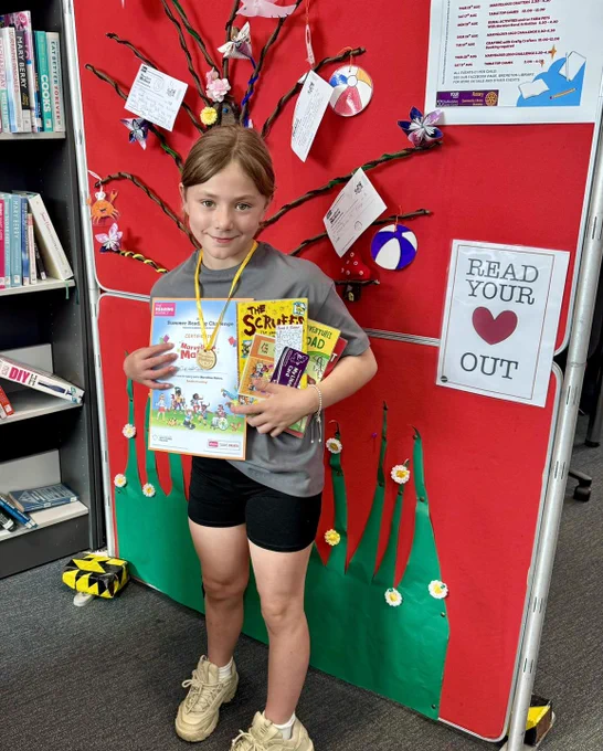 Child with certificate and medal