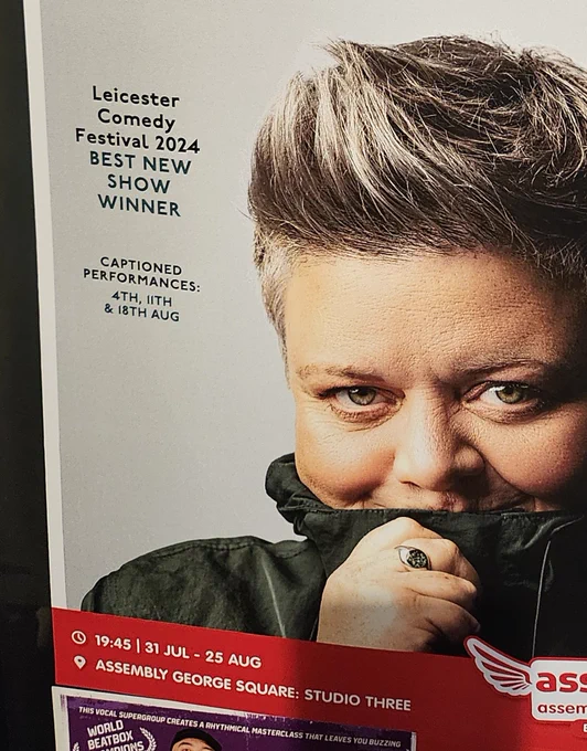 A woman looks out mischievously from her high-necked parka.