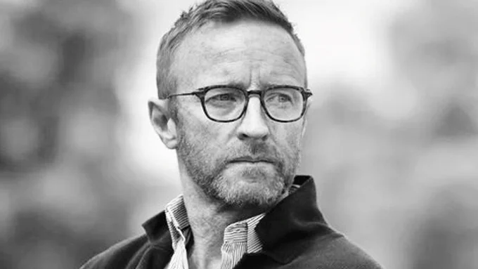 Black and white photo of Ben Ryan looking off screen