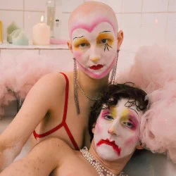 Two clowns with sad painted faces