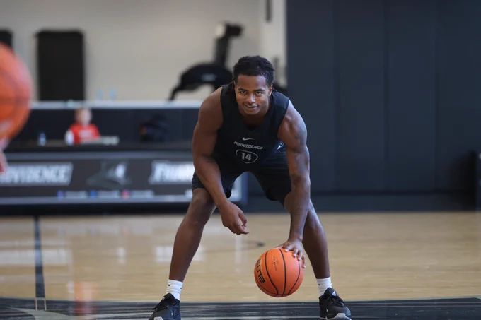 Corey Floyd Jr. dribbling on the court at practice