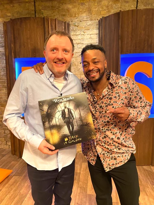 Chris McCausland stood with singer Wyn Starks