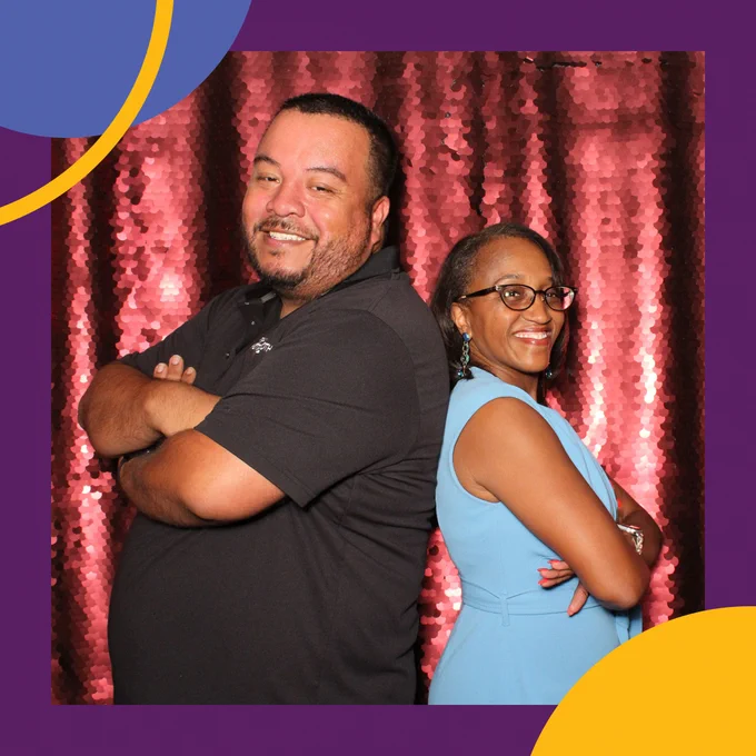 Dr. Sayles-Adams poses with her former 8th grade student, Jorge, who was running the photo booth.