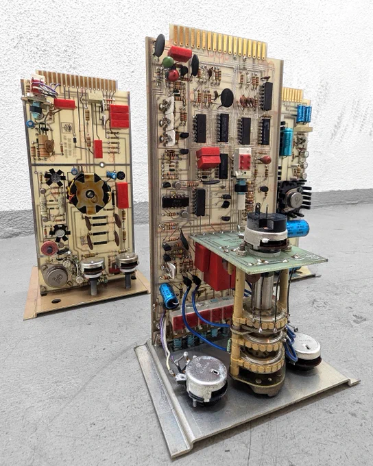 Light brown circuit board with various elements, three pieces.